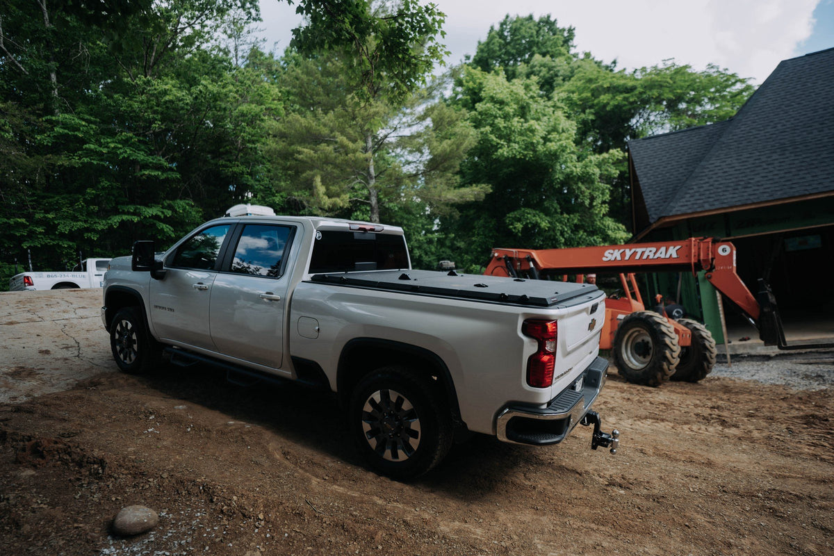 Chevrolet Silverado 2500HD work truck with a Tectonic tri-fold tonneau cover