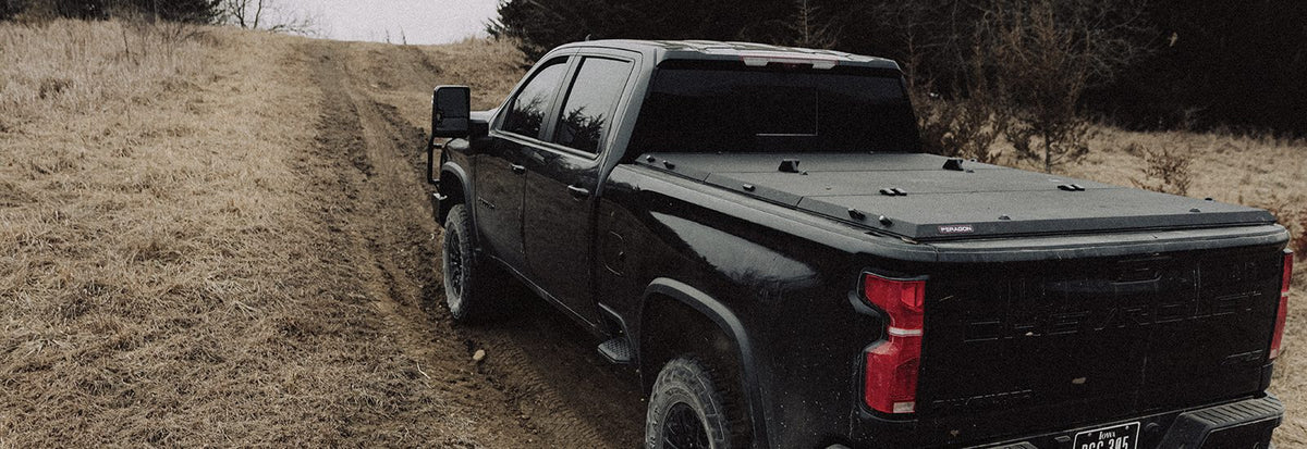 Chevrolet Silverado 2500HD work truck with a Tectonic tri-fold tonneau cover