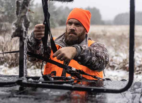 A hunter attaching gear to the cover