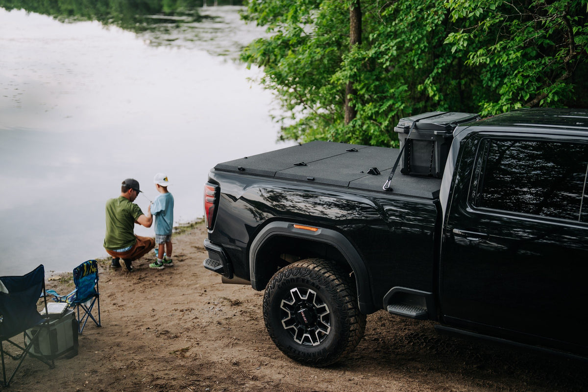 GMC Sierra HD with a Tectonic tri-fold tonneau cover at the lake