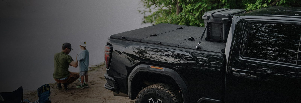 GMC Sierra HD with a Tectonic tri-fold tonneau cover at the lake