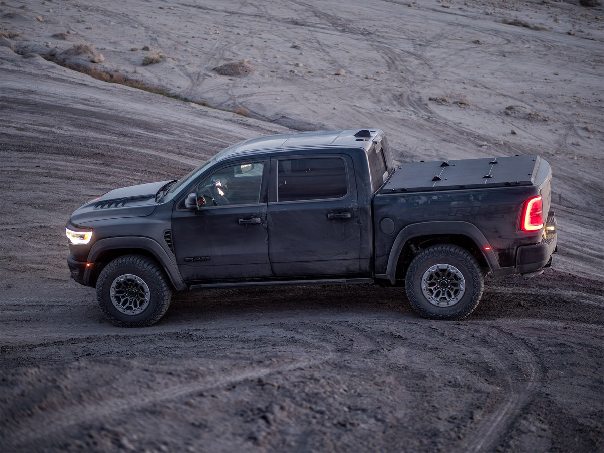 Ram 1500 TRX with a Tectonic tri-fold tonneau cover in the desert