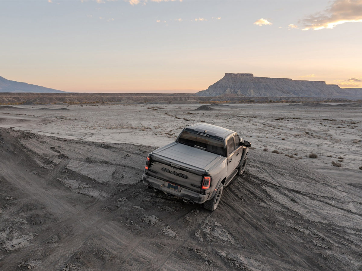 Ram 1500 TRX with a Tectonic tri-fold tonneau cover in the desert