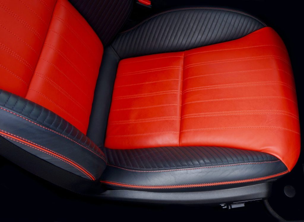 Photo by Mike from Pexels: https://www.pexels.com/photo/black-and-orange-car-seat-498702/