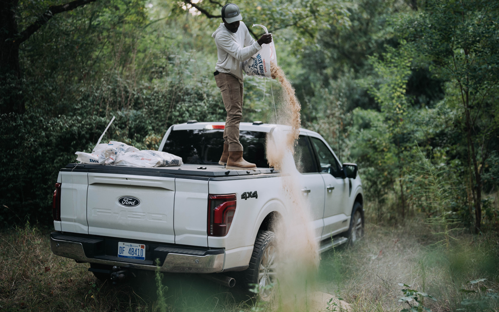 man standing on Tectonic truck bed cover